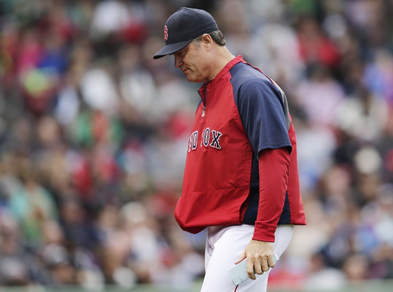 Sox manager John Farrell heads back to the dugout after removing starter Jon Lester during the seventh inning against the Toronto Blue Jays in a baseball game at Fenway Park, Thursday, May 22, 2014. (Charles Krupa/AP)