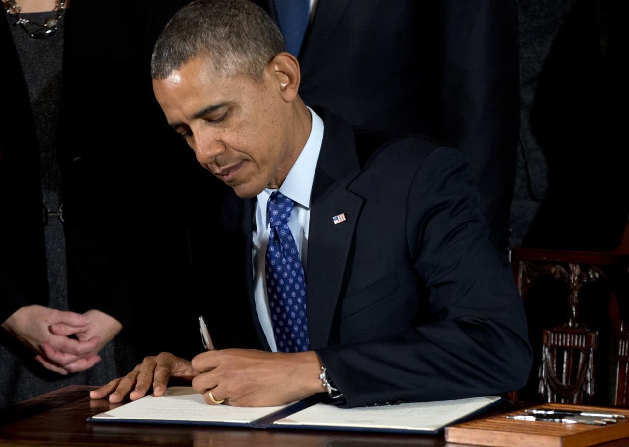 In this Jan. 22, 2014, file photo, President Barack Obama signs a memorandum creating the White House Task Force to Protect Students from Sexual Assault. The report was released Tues, April 29, 2014. (AP)