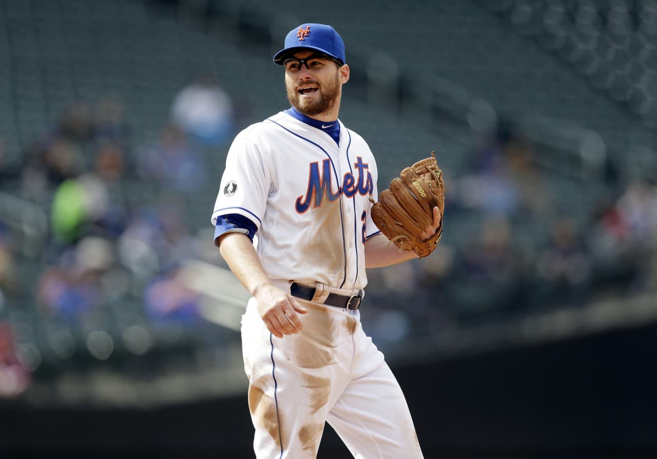 New York Mets' Daniel Murphy, pictured here on April 3, 2014, says he is proud he put fatherhood ahead of baseball, and Mets manager Terry Collins thinks criticism his second baseman received for taking paternity leave was unfair. (Seth Wenig/AP)