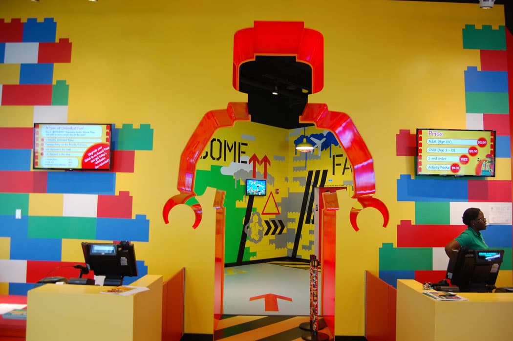 Visitors enter Legoland through a giant silhouette of a Lego Minifigure cut in the lobby wall. (Greg Cook)