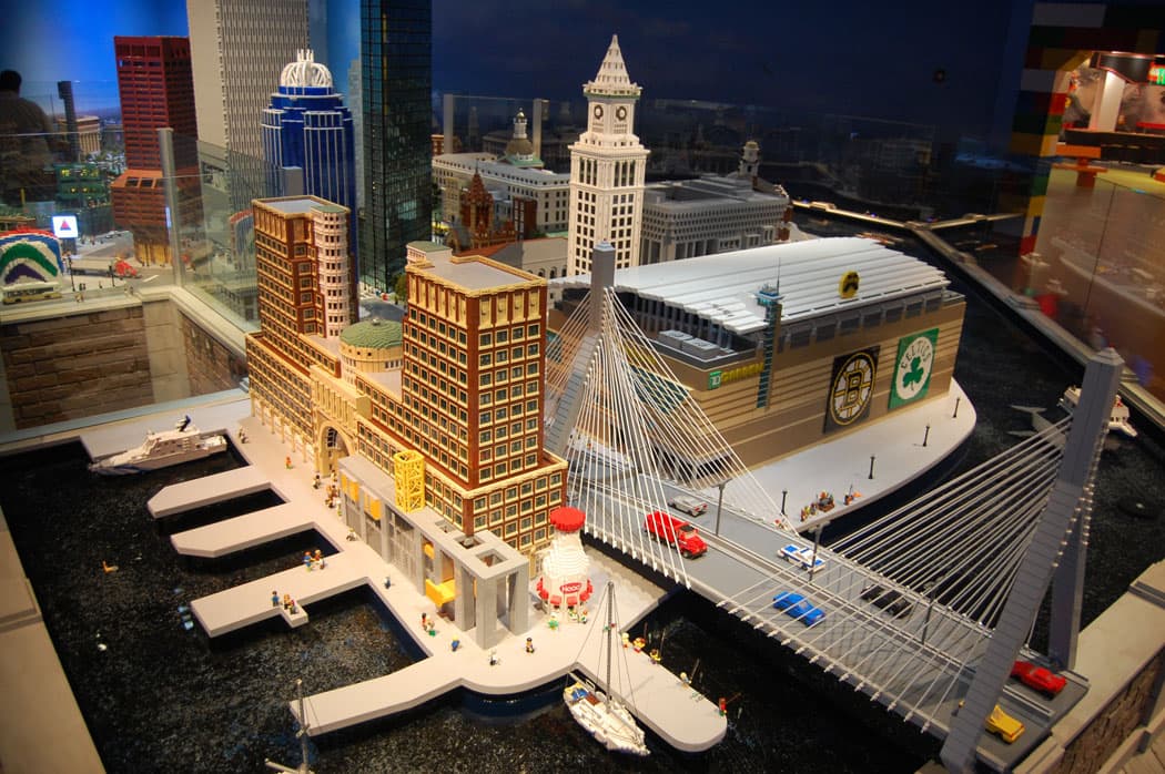The Boston Harbor Hotel (from left), Children’s Museum (with giant milk jug), the Zakim Bunker Hill Bridge, the Custom House Tower and TD Garden are recreated in Legos in the “Miniland” display. (Greg Cook)