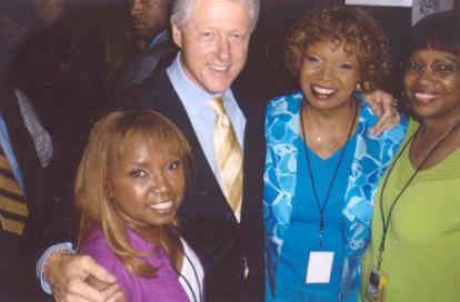 The Dixie Cups pose for a photo with former U.S. President Bill Clinton in September 2005. (Courtesy of the Dixie Cups)