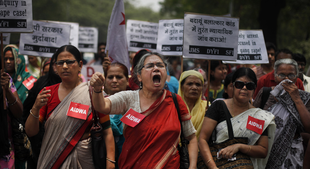 In this Saturday, May 31, 2014 file photograph, members of the All India Democratic Women's Association (AIDWA) shout slogans during a protest against the gang rape of two teenage girls, in New Delhi, India. Beyond highlighting the rampant sexual violence in India, the horrific crime is drawing attention to a glaring and fundamental problem across the country that threatens women’s safety: the lack of toilets. The placards read: "Arrest all accused in the gang rape." (Altaf Qadri/AP)