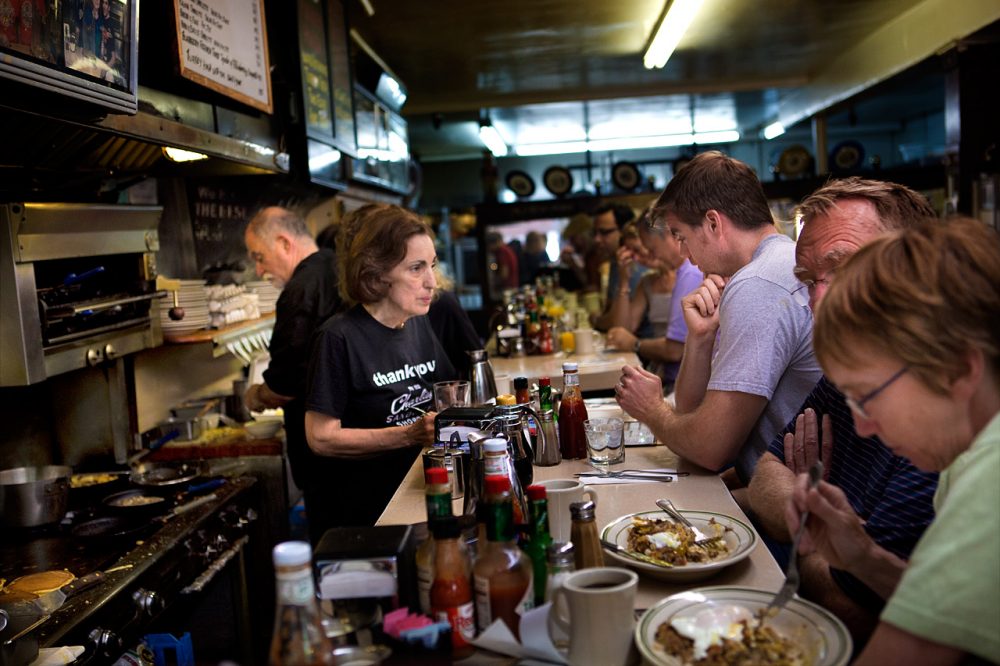 Marie Fuller takes an order from one of the many regular customers at Charlie’s. She has been working at the restaurant for 40 years with her co-owner brothers.. (Jesse Costa/WBUR)