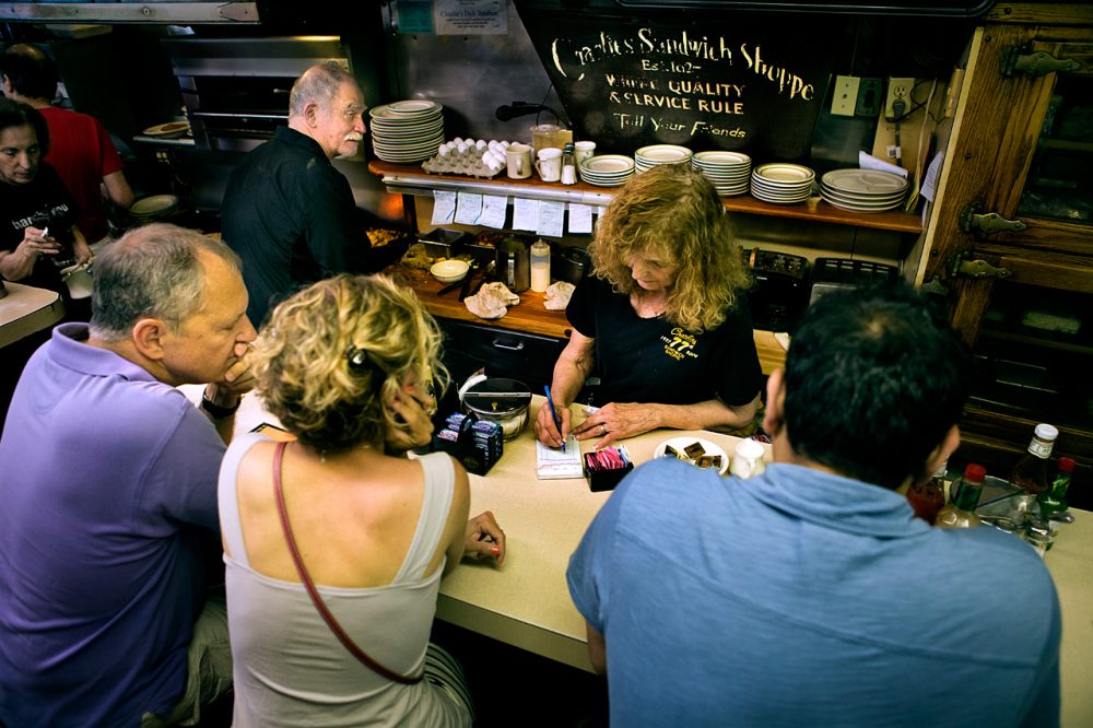 Fontaine Anzalone taking an order at the counter. (Jesse Costa/WBUR)