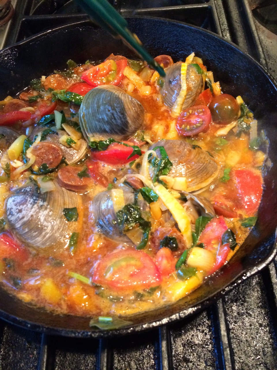 Kathy Gunst cooks her "Summer Clams with Chorizo, Tomatoes and Basil." (Kathy Gunst)