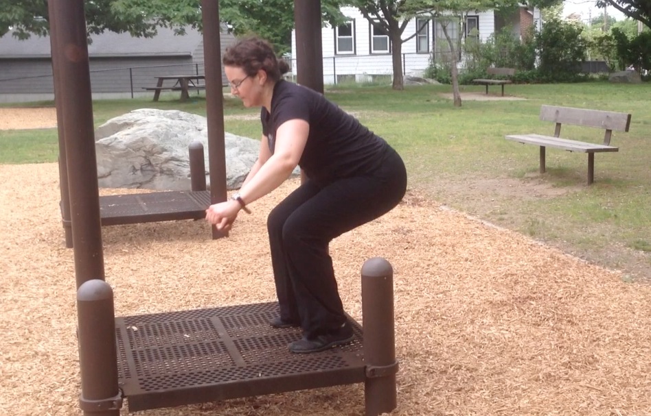 Kat demonstrates the landing of a jump squat onto a low platform.