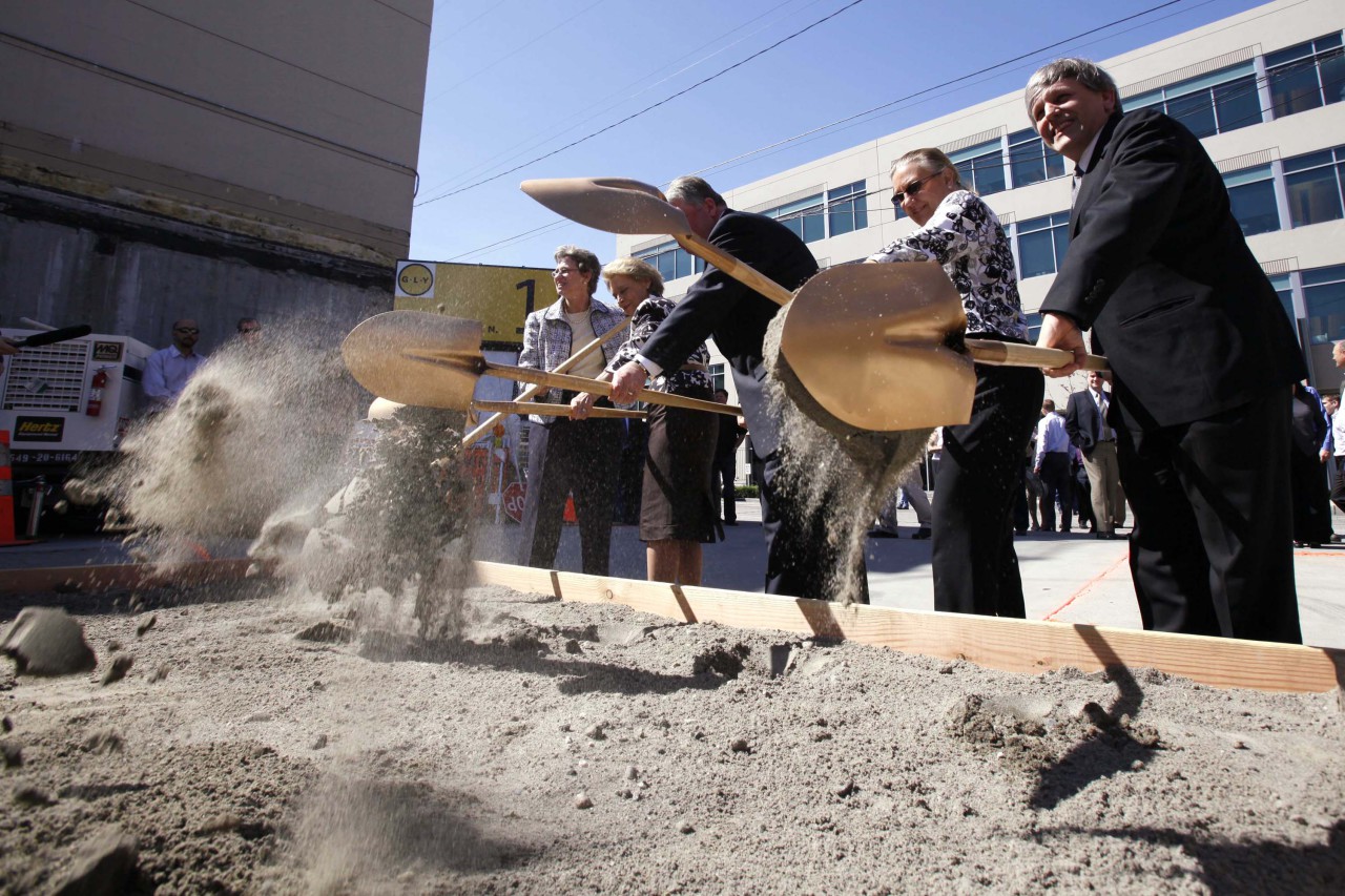 In this file photo, officials, including from left Vulcan real estate vice president Ada Healey, Gov. Chris Gregoire, Mayor Greg Nickels, City Councilmember Jan Drago and Capitol Hill Housing executive director Christopher Persons, toss shovels of sand in a ceremonial ground breaking for new Amazon.com headquarters Monday, April 20, 2009, in Seattle. The new headquarters now includes 11 buildings on six blocks in the heart of Seattle's South Lake Union neighborhood. (AP