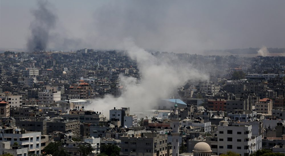 Jim Walsh: &quot;A metaphor can be a dangerous thing. It can even kill.&quot; Pictured: Smoke from an Israeli strike rises over Gaza City, Thursday, July 24, 2014. Israeli tanks and warplanes bombarded the Gaza Strip on Thursday, as Hamas militants stuck to their demand for the lifting of an Israeli and Egyptian blockade in the face of U.S. efforts to reach a cease-fire. (Hatem Moussa/AP)