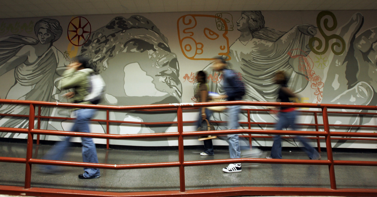English High School students walk past a mural at the school in Boston's Jamaica Plain neighborhood. (AP)