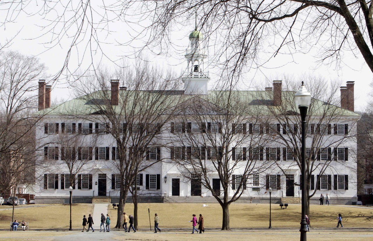 In this photo taken Monday, March 12, 2012, students walk across the Dartmouth College campus green in Hanover, N.H. (AP)
