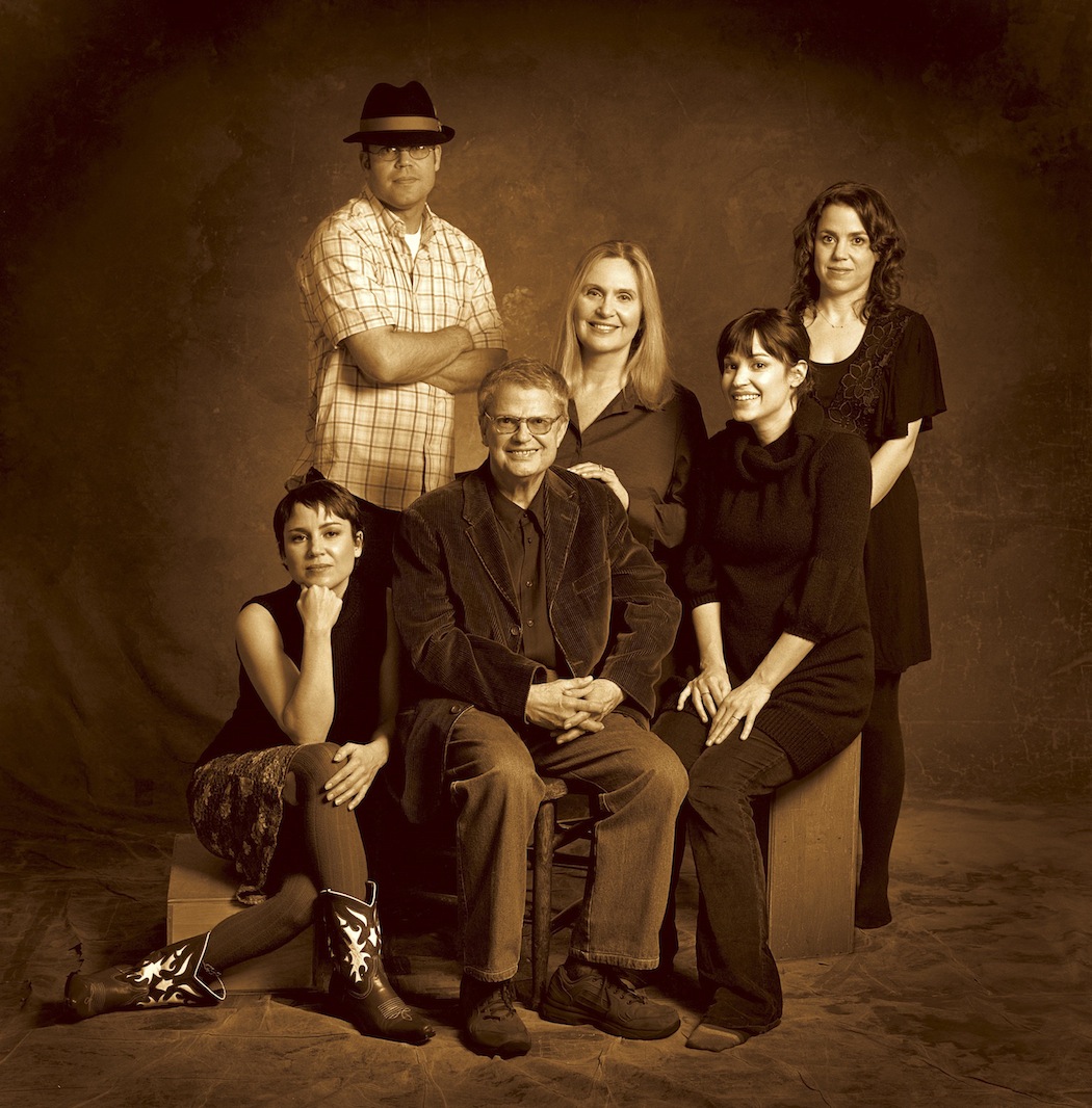 Charlie Haden, center, posing  with his wife Ruth Cameron, third from right, his son Josh, second from left, and triplet daughters, from left to right, Rachel, Tanya and Petra. (Universal Music Group/AP) 