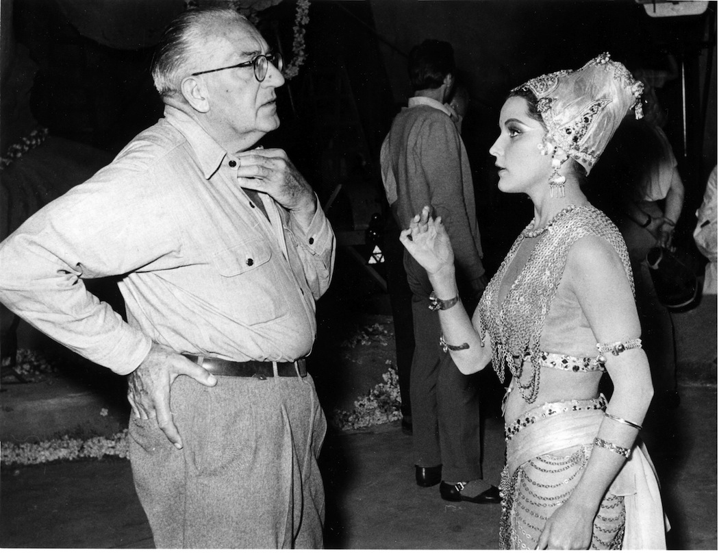 Fritz Lang discusses a dance scene with Debra Paget, in the role of Indian temple dancer Seetha, at the CCC-Filmstudios in Berlin-Spandau, Germany, 1958, where the interior scenes for the twin film production 'The Tiger of Eshnapur' and 'The Indian Tomb' were shot. (Werner Kreusch/AP)