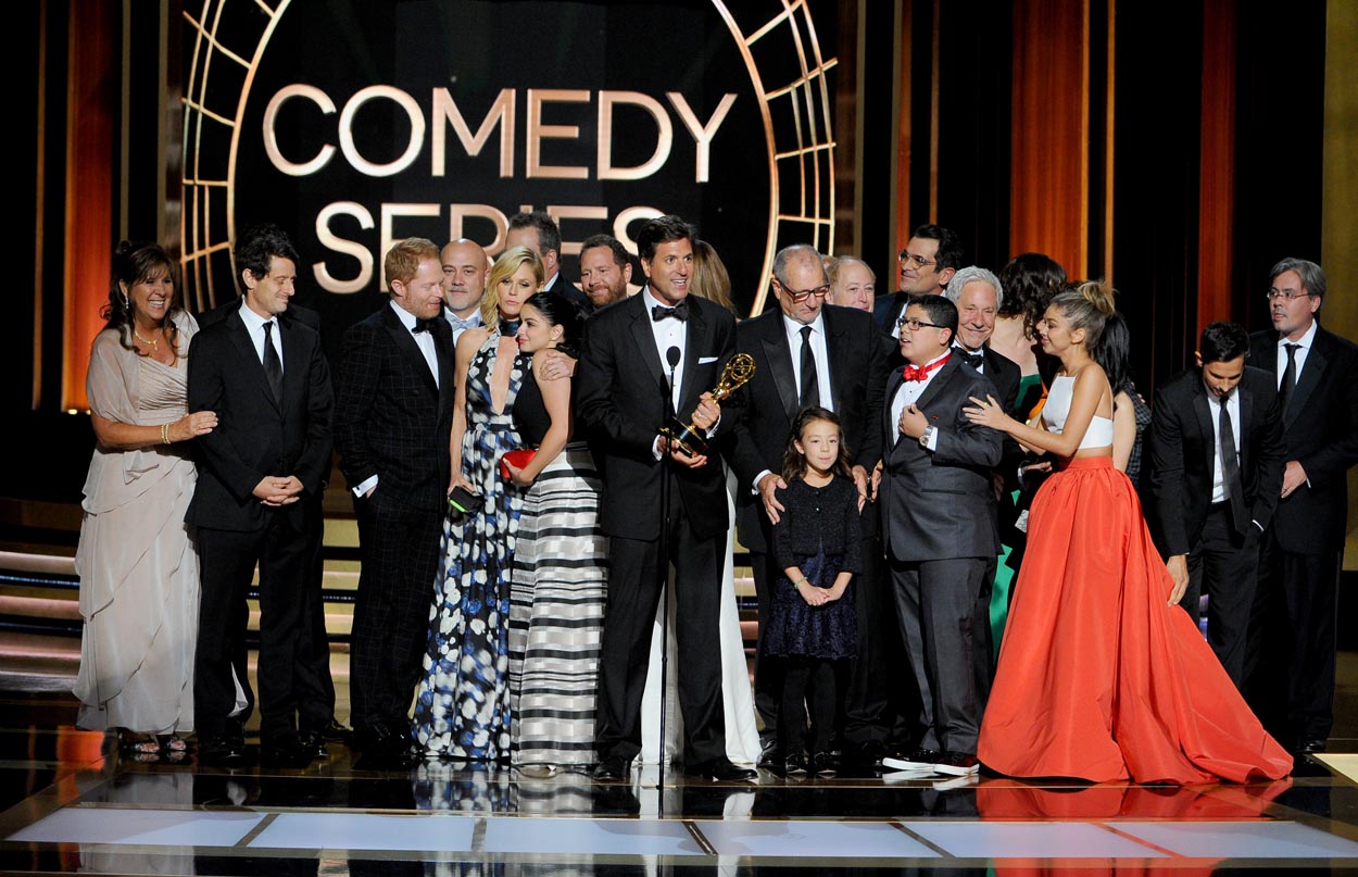 Steven Levitan, center, and the producers and cast of “Modern Family” accept the award for outstanding comedy series at the 66th Primetime Emmy Awards at the Nokia Theatre L.A. Live on Monday, Aug. 25, 2014, in Los Angeles. (Vince Bucci/Invision for the Television Academy/AP)