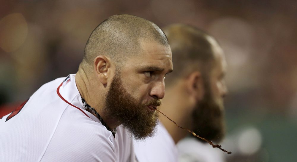 E.M. Swift: &quot;Tobacco, in any of its forms, has no business on an athletic field. It’s way past time for Major League Baseball and its Players Association to face up to that.&quot; Boston Red Sox's Jonny Gomes expels tobacco juice as he watches from the dugout during the sixth inning in Game 2 of baseball's American League division series against the Tampa Bay Rays Saturday, Oct. 5, 2013, in Boston. (Charles Krupa/AP)