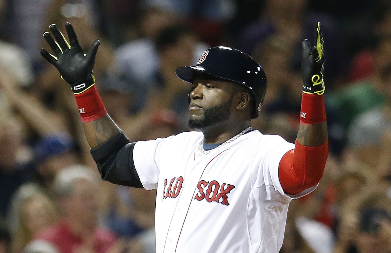 Red Sox's David Ortiz celebrates his two-run home run during the third inning Saturday. (Michael Dwyer/AP)