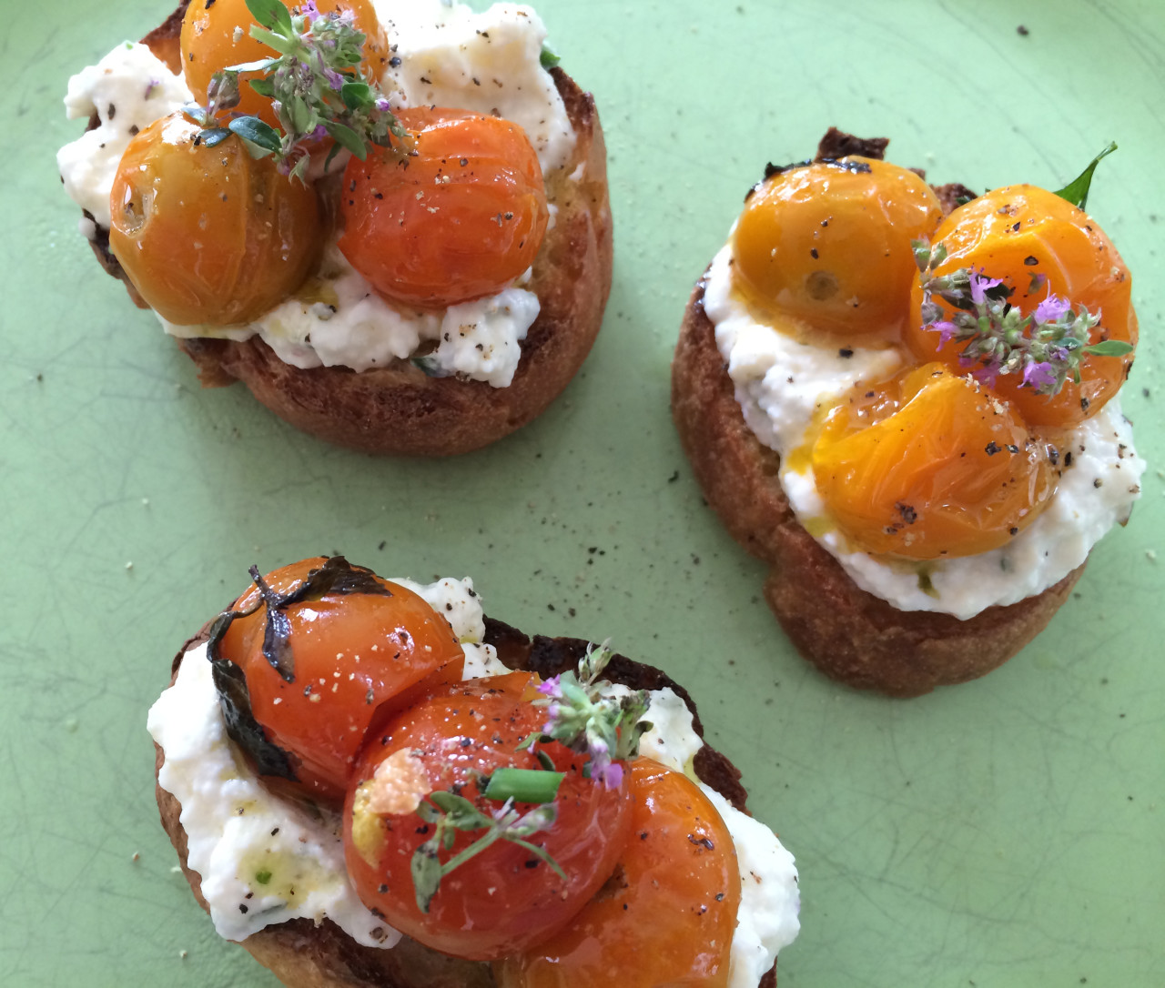 Ricotta toasts with slow-roasted tomatoes. (Kathy Gunst/Here &amp; Now)