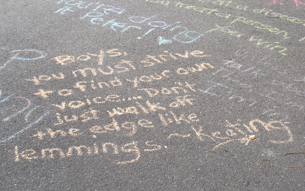 One of the chalk messages from Williams' role in "Dead Poets Society," written at the makeshift memorial Tuesday (Andrea Shea/WBUR)