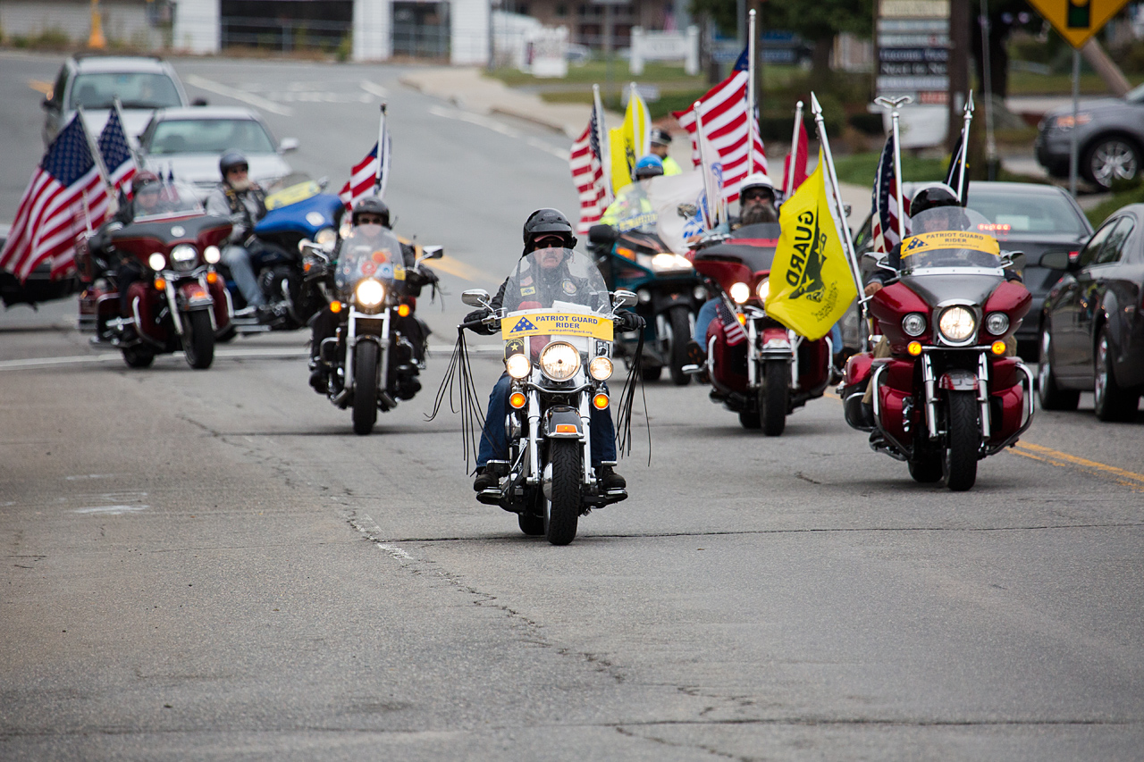 The Patriot Guard Riders show support for Arsenault by riding by the St Rose Of Lima Parish. (Jesse Costa/WBUR)
