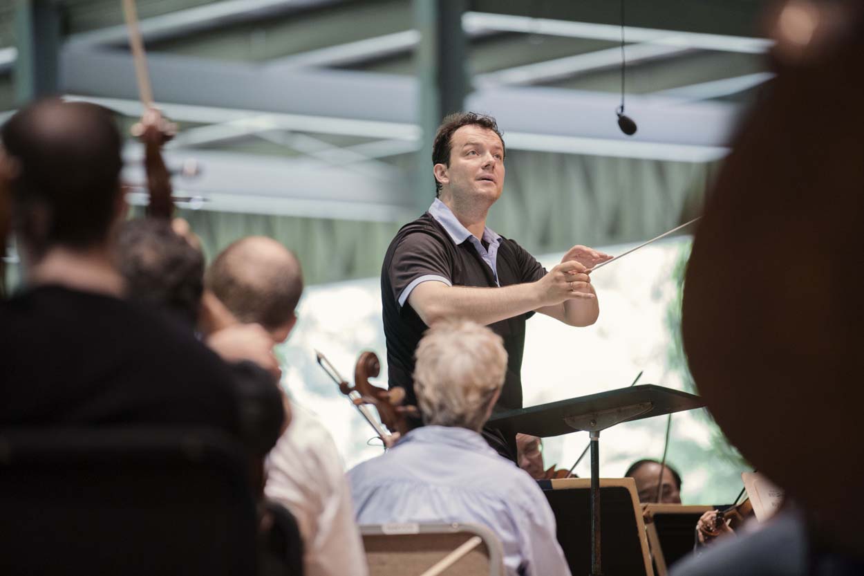Andris Nelsons directs a Boston Symphony Orchestra rehearsal at Tanglewood in July. (Courtesy Marco Borggreve/BSO)