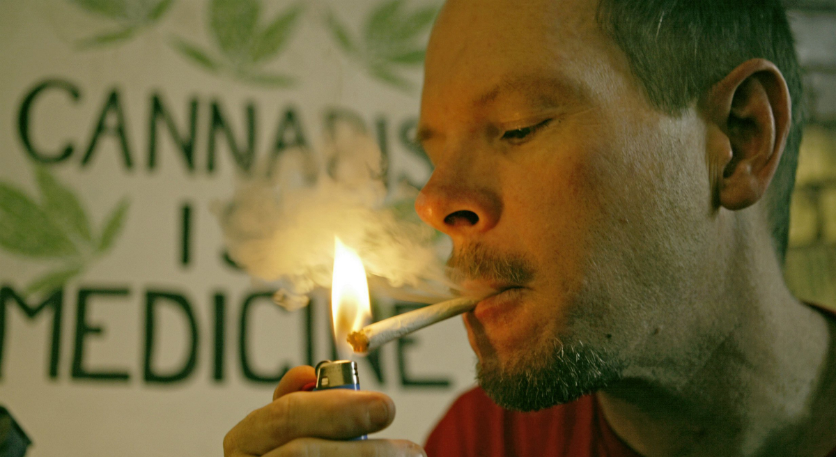 States with legalized medical marijuana have fewer overdose deaths from narcotics. Exploring the medical and legal implications of this surprising correlation. Pictured: Bill Britt, executive director of the Association of Patient Advocates, uses cannabis to help his ease the chronic pain he suffers due to an epilepsy and post-polio syndrome condition at his home in Long Beach, Calif. (Damian Dovarganes/AP)