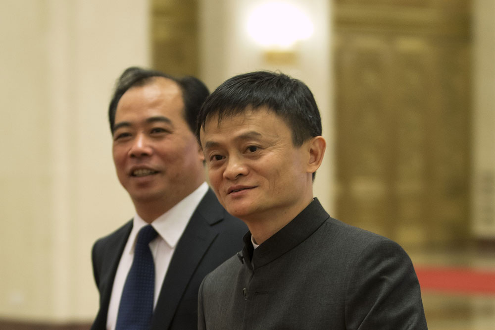 In this June 11, 2014 photo, Jack Ma, right, founder and executive chairman of Alibaba Group arrives for a meeting at the Great Hall of the People in Beijing, China. (AP/Andy Wong)