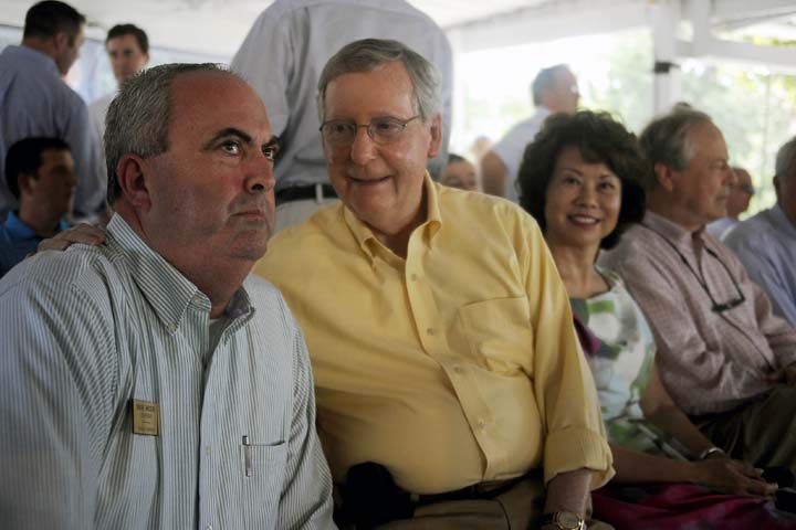 U.S. Sen. Mitch McConnell, R-Ky., talks with Mark Wilson, event political speaker chairperson, with his wife Elain Chao, former U.S. Secretary of Labor, at the annual Fancy Farm Picnic in Fancy Farm, Ky., Saturday, August 4, 2012. (AP)