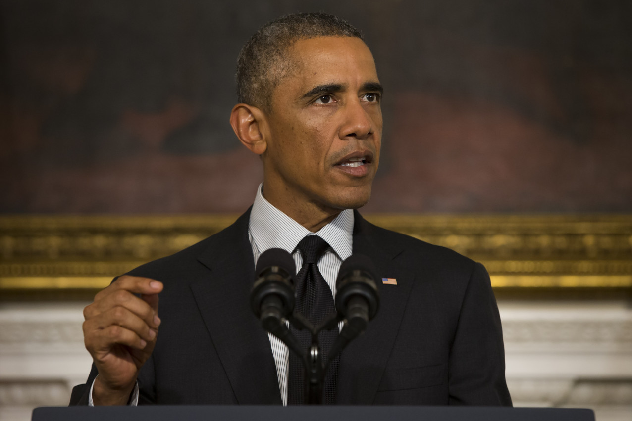 President Barack Obama gestures during a statement in the State Dining Room of the White House, on Thursday, Sept. 18, 2014, in Washington. Obama spoke after Congress voted to arm and train moderate Syrian rebels in the fight against the Islamic State group. (AP/Evan Vucci)