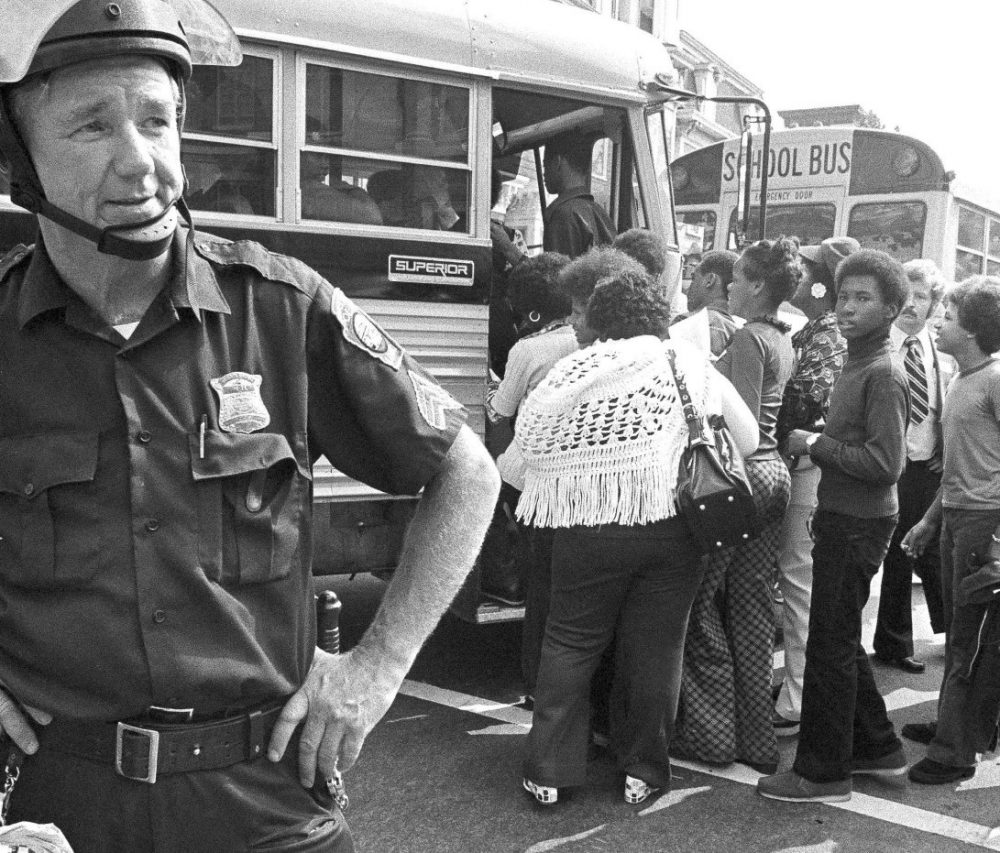 African-American students board a school bus outside South Boston High School on Sept. 12, 1974 — the first day of school and the first day of court-ordered busing. (AP)
