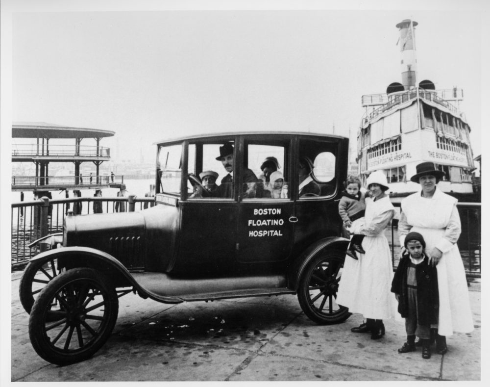A shuttle car transported patients to and from their homes, the boat and the on-shore department. The whooping cough clinic soon became its principle destination. Taken in 1924. (Courtesy Tufts Medical Center)