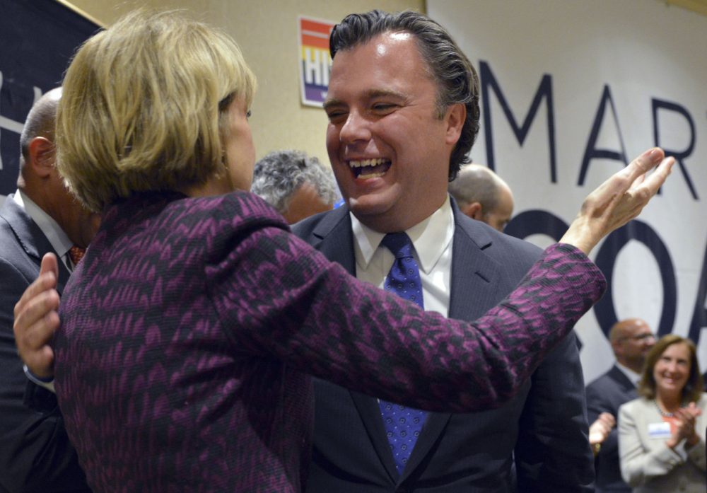 Democrat gubernatorial nominee, state Attorney General Martha Coakley embraces lieutenant governor nominee Steve Kerrigan at the party's unity breakfast Sept. 10. (Josh Reynolds/AP)