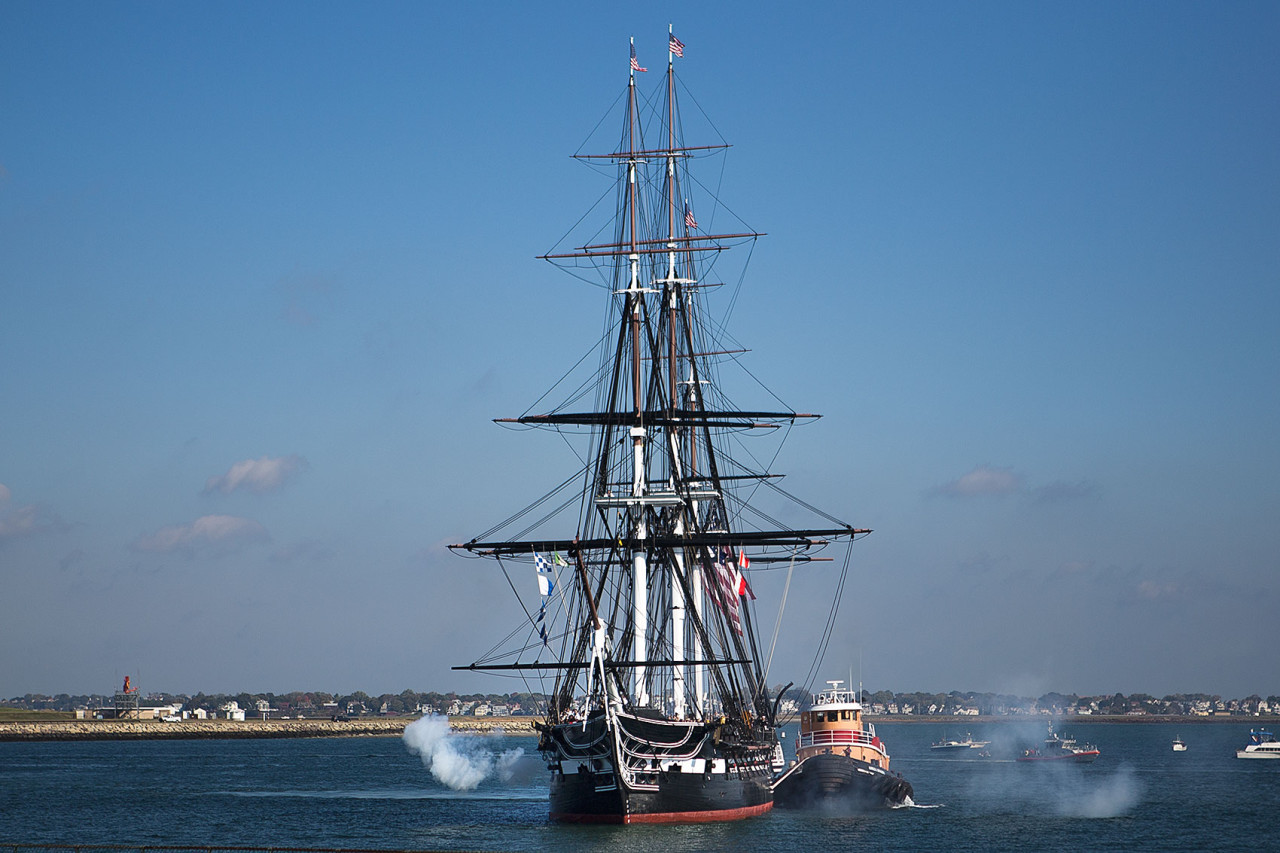 The USS Constitution fires one of its cannons. (Jesse Costa/WBUR)