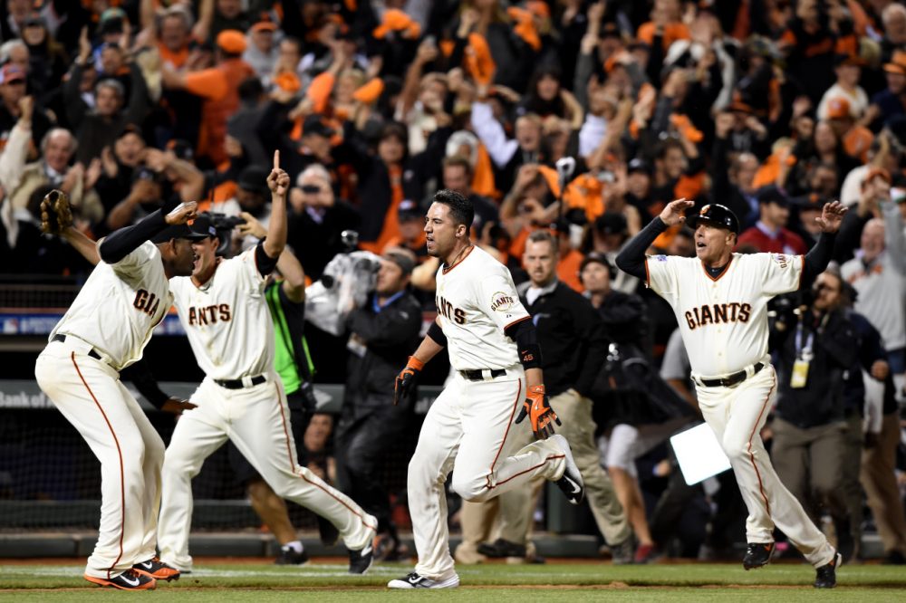 With a dramatic walk-off home run from Travis Ishikawa (center), the San Francisco Giants punched their ticket to the World Series. (Thearon W. Henderson/Getty Images)