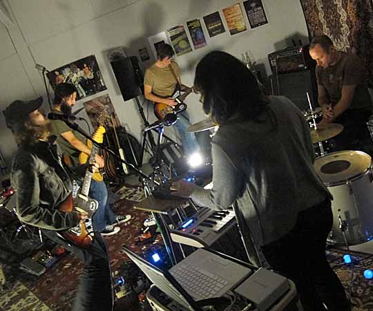 The Ghost Box Orchestra practices in their usual space. The local band played at Peter Bebergal’s reading for “Season of the Witch.” (Andrea Shea/WBUR)