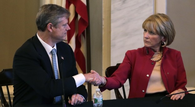 Mass. Republican nominee for governor Charlie Baker, shakes hands with Democratic nominee Martha Coakley following a candidates forum Sept. 24, 2014. (Charles Krupa/AP)
