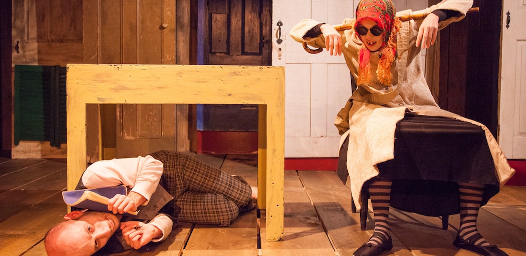 William Schuller as The Author struggles at his writing desk as Molly Kimmerling as The Babushka cackles nearby in Imaginary Beasts' "KNOCK! The Daniil Charms Project." (Roger Metcalf)