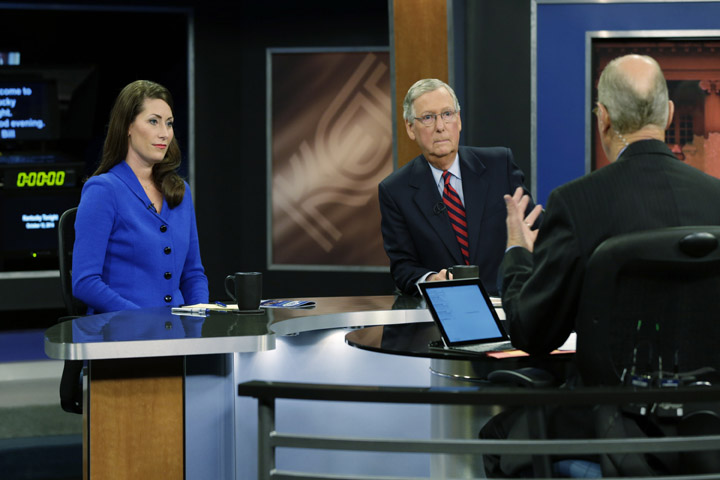 U.S. Senate Minority Leader Mitch McConnell (R) Ky., center, and Democratic opponent, Kentucky Secretary of State Alison Lundergan Grimes, rehearsed with host Bill Goodman before their appearance on "Kentucky Tonight" television broadcast live from KET studios in Lexington, Ky.,Monday, Oct. 13, 2014. (AP)