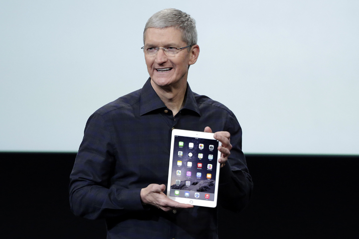 Apple CEO Tim Cook introduces the new Apple iPad Air 2 during an event at Apple headquarters on Thursday, Oct. 16, 2014 in Cupertino, Calif. The CEO publicly acknowledged that he was gay for the first time in a Bloomberg Businessweek column in late October 2014. (AP)