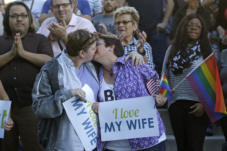Married couple Penny Kirby, left, and Terri Henry kiss during a gay marriage rally Monday, Oct. 6, 2014, in Salt Lake City. Same-sex couples in Utah were celebrating after the U.S. Supreme Court on Monday cleared the way for gay marriages to begin in this state and 30 others. (AP)