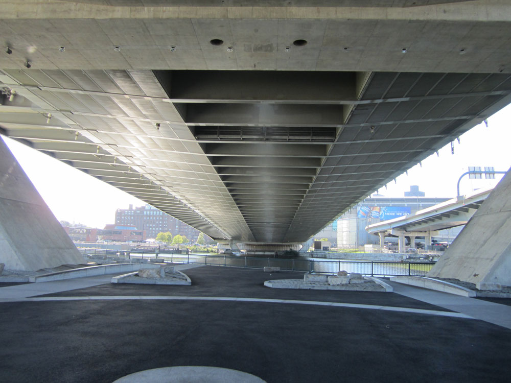 The skate park will be located underneath ramps for the Zakim Bridge. There will be a new "hardscape" space under the bridge that will be used for events for the skate park. (Courtesy of Ross Miller/Charles River Conservancy)