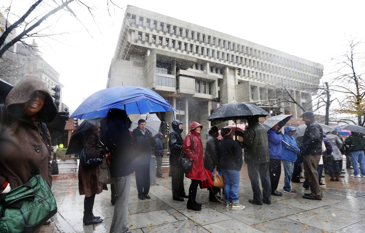 Mourners line up across from City Hall to attend the wake for former Boston Mayor Thomas Menino at Faneuil Hall. (Michael Dwyer/AP)