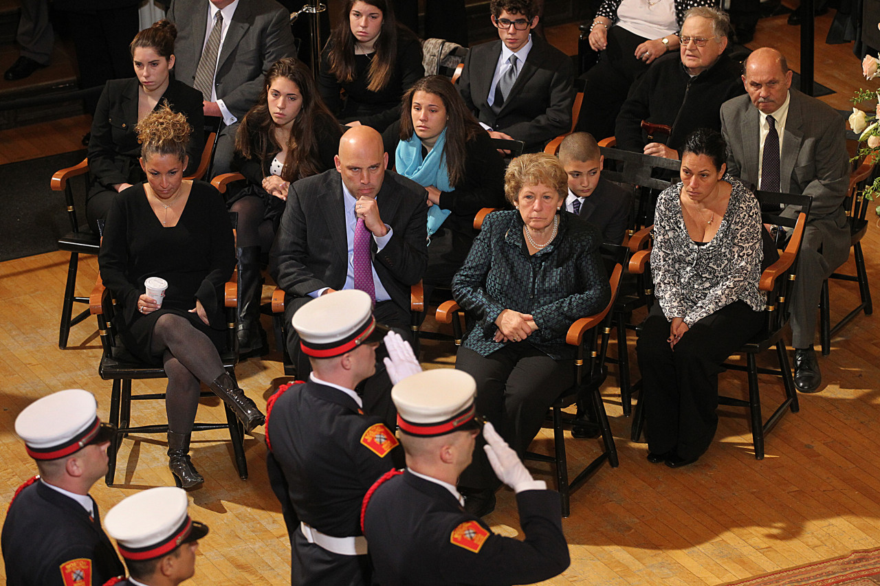 Angelo Menino, center right, widow of late Boston Mayor Tom Menino, their two children, and six grandchildren watch during a viewing ceremony. (Suzanne Kreiter/The Boston Globe/AP)