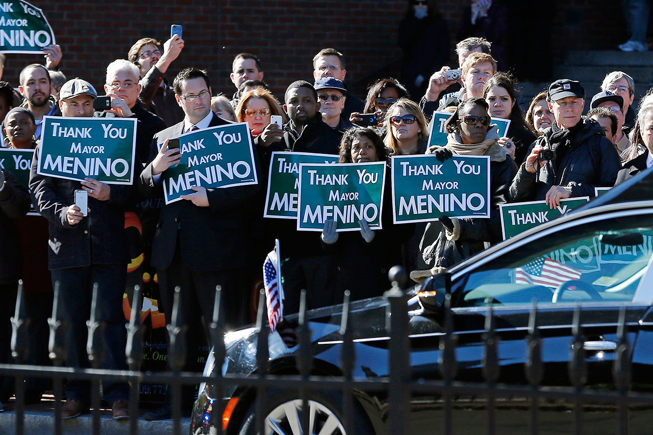 Mourners line the street outside City Hall in Boston as the hearse bearing the body of former Boston Mayor Thomas Menino passes. (Elise Amendola/AP )