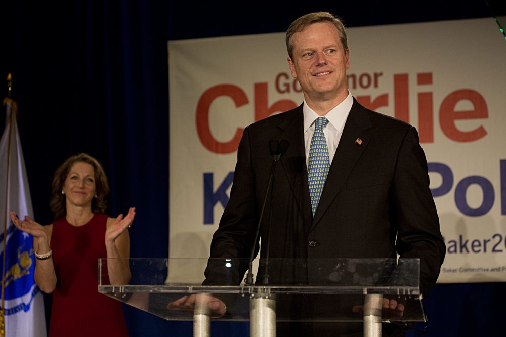 Charlie Baker, with wife Lauren, at his Election Night victory party in Boston (Jesse Costa/WBUR)