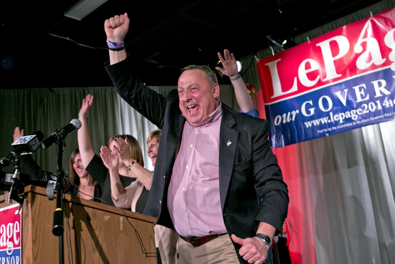 Gov. Paul LePage celebrates his re-election bid at his election night party, Wednesday. LePage defeated Democrat Mike Michaud and independent Eliot Cutler. (Robert F. Bukaty/AP)