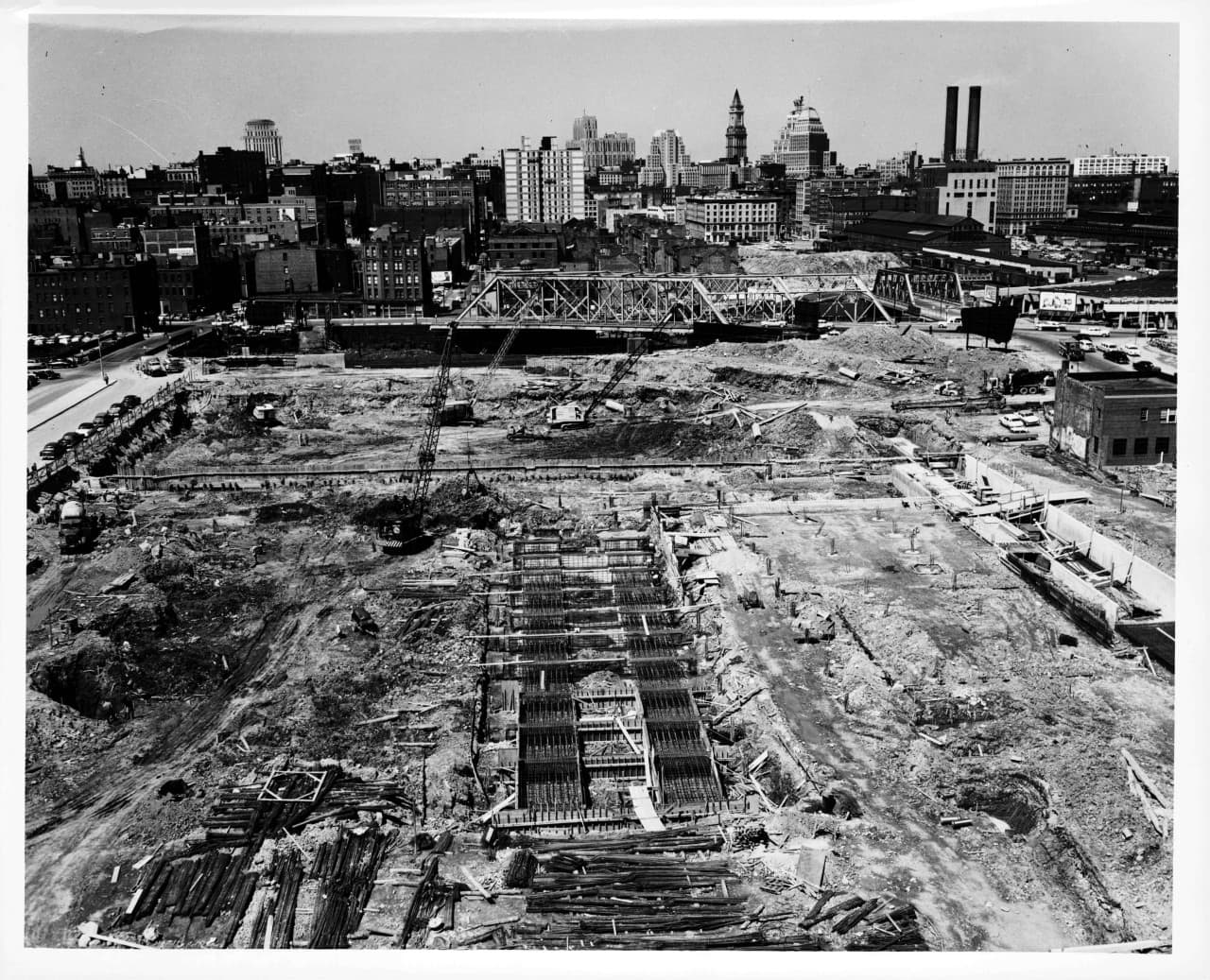 The 1955 razing of the New York streets in the South End. With names like Oswego, Rochester, Troy, Oneida and the sole survivor, Albany, the New York streets were a crowded, diverse and vibrant section of the South End. As the first urban renewal project in Boston, the demolition made way for various civic and commercial enterprises. Displacing more than 800 families from their homes and shuttering businesses, the wholesale leveling of the neighborhood predated the demolition of the West End by several years. 1958. (Courtesy City of Boston)