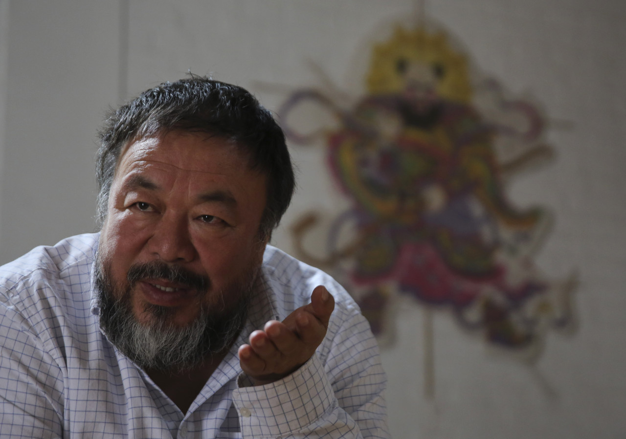 Chinese outspoken artist Ai Weiwei speaks during an interview at his home in Beijing, China in September. (Andy Wong/AP)