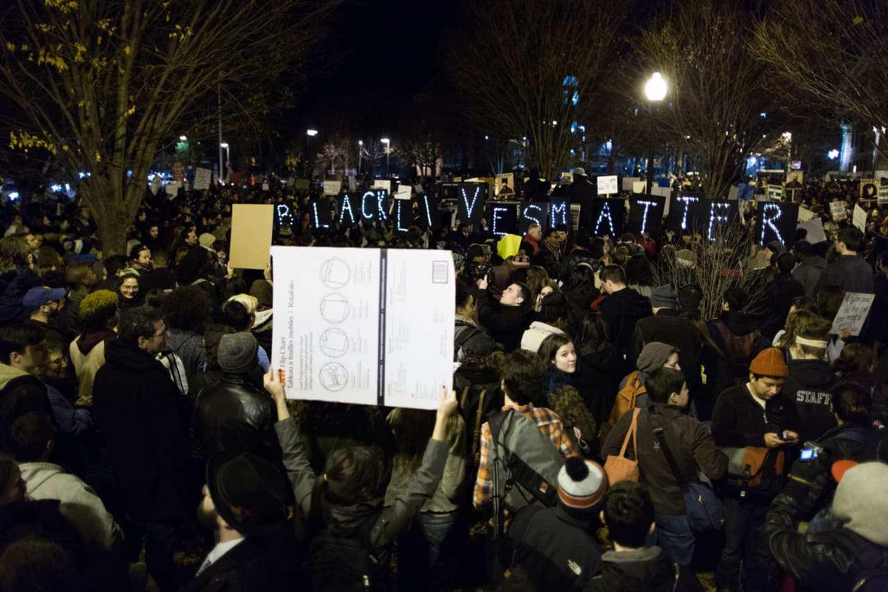 Protesters, numbering in the hundreds, gathered in Boston in response to a grand jury's recent decision in shooting death of Michael Brown in Ferguson, Mo. (Joe Spurr/WBUR)