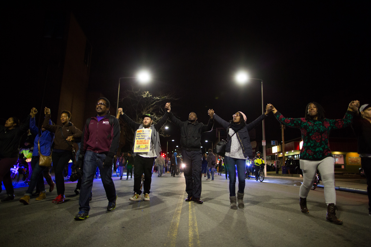 In Boston, hundreds of protesters marched through the city streets in solidarity with demonstrators in Ferguson in the aftermath of a grand jury's decision to not indict a white officer who shot and killed an unarmed black teen. (Joe Spurr/WBUR)