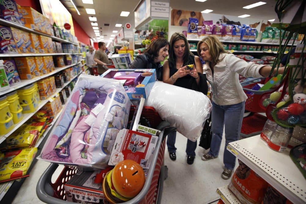 Kelly Foley, left, Debbie Winslow, center, and Ann Rich shopped Black Friday deals at Target in South Portland, Maine, on Nov. 28, 2014. (Robert F. Bukaty/AP)